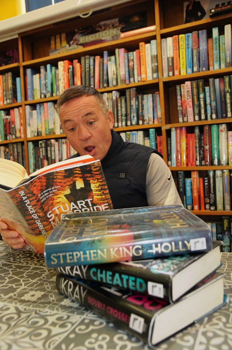 Community visitor reading a shocking novel!